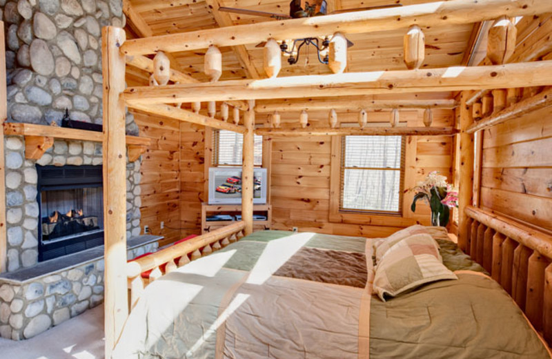 King fireplace bedroom at Alpine Mountain Chalets. 