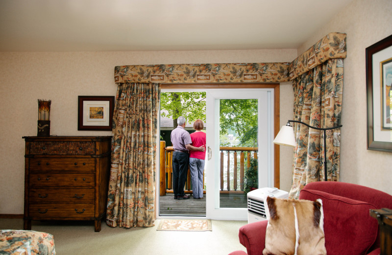 Guests enjoying the private balcony at Heather Lodge in the Deluxe Studio.