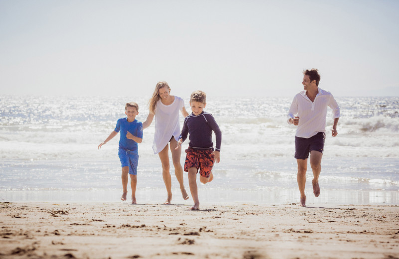 Family on beach at The Ritz-Carlton, Laguna Niguel.