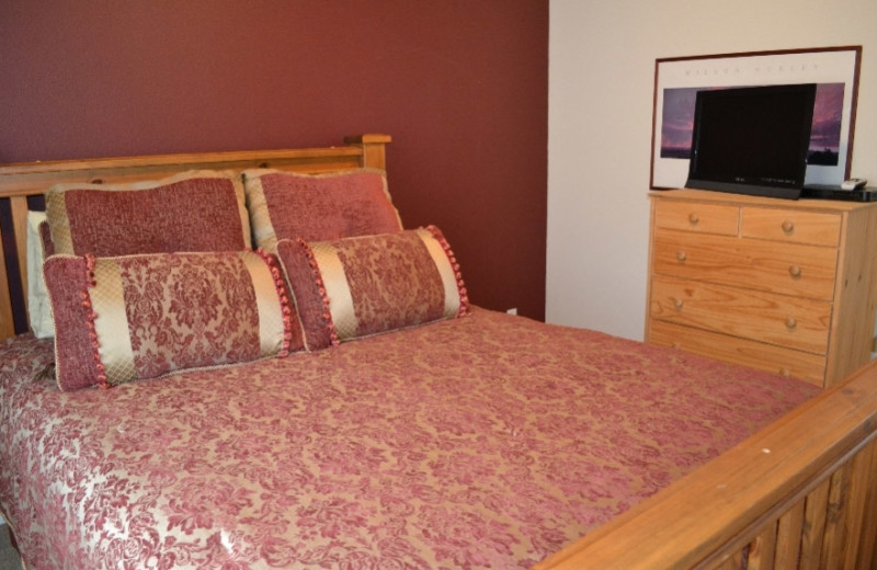 Bedroom at Beachhouse Vacation Rentals.