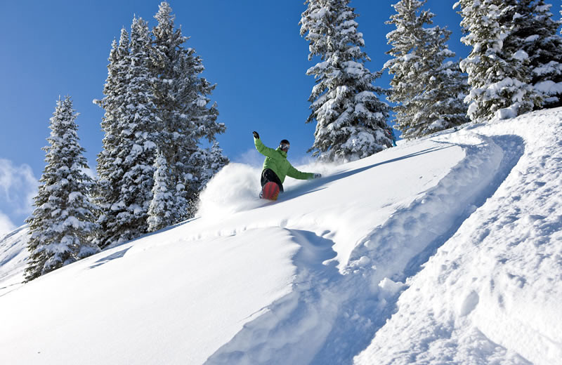 Snowboarding down Vail Mountain at Vail's Mountain Haus.