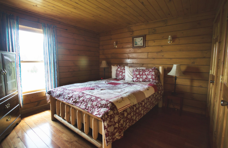 Cabin bedroom at Cobtree Vacation Rental Homes.