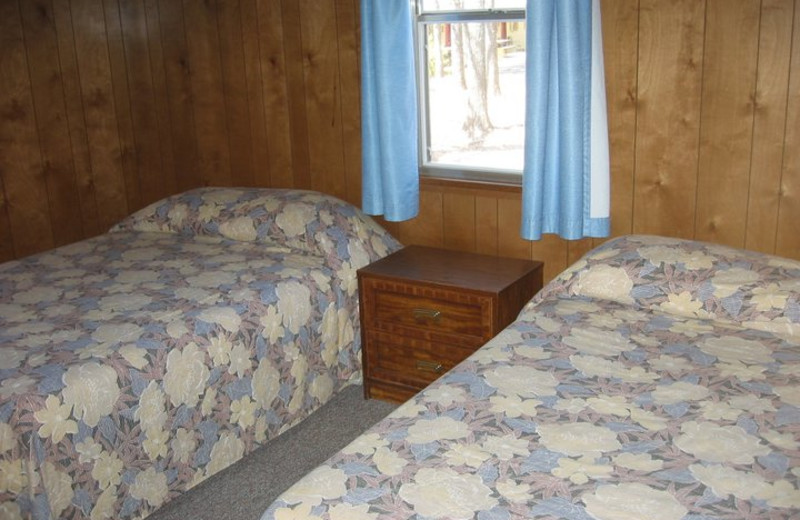 Cabin bedroom at Golden Arrow Resort.