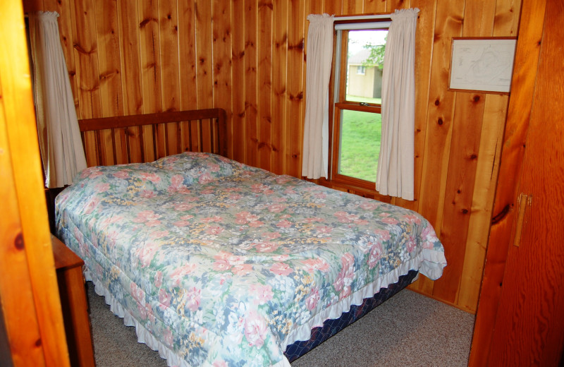 Cottage bedroom at Fisher's Lakeside Cottages.