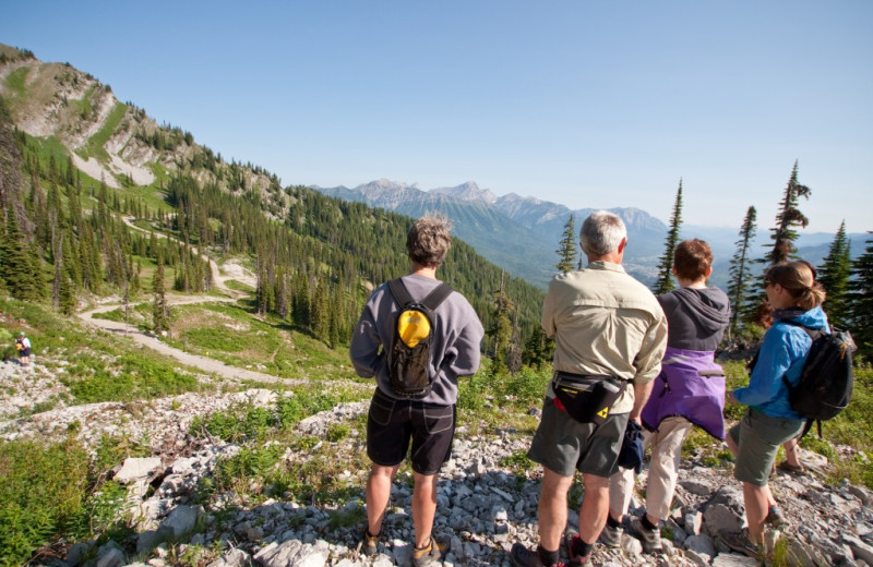 Family hiking in mountain at Red Tree Lodge.