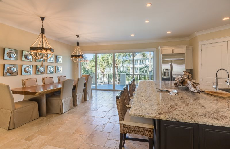 Rental kitchen and dining room at Luxury Properties Vacation Rentals.