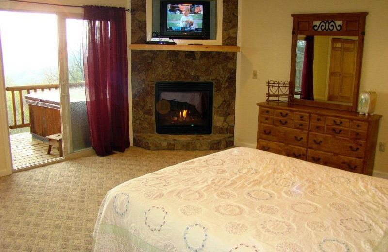 Cabin bedroom at Great Smokys Cabin Rentals.