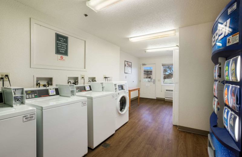 Laundry room at HomeTowne Studios Detroit - Livonia.