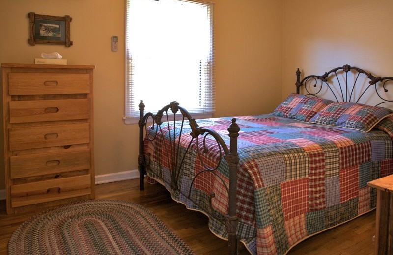 Cabin bedroom at  Sylvan Dale Guest Ranch.