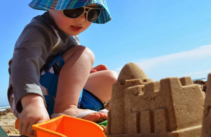 Kid building sand castle at Seabreeze I.