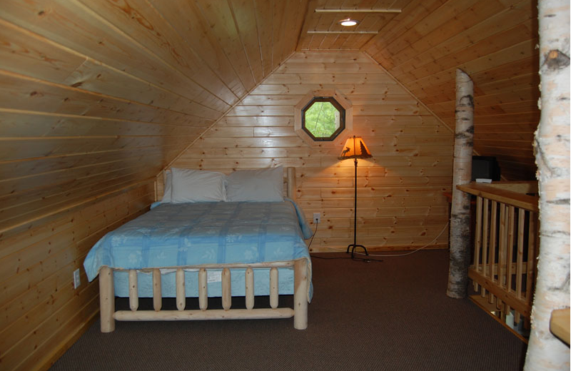 Cottage bedroom at The Elms Waterfront Cottages.
