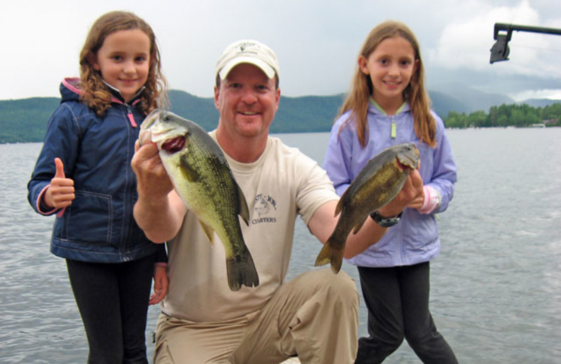 Family fishing at Northern Lake George Resort.