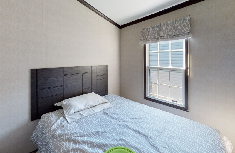 Cottage bedroom at Great Blue Resorts- Shamrock Bay Resort.
