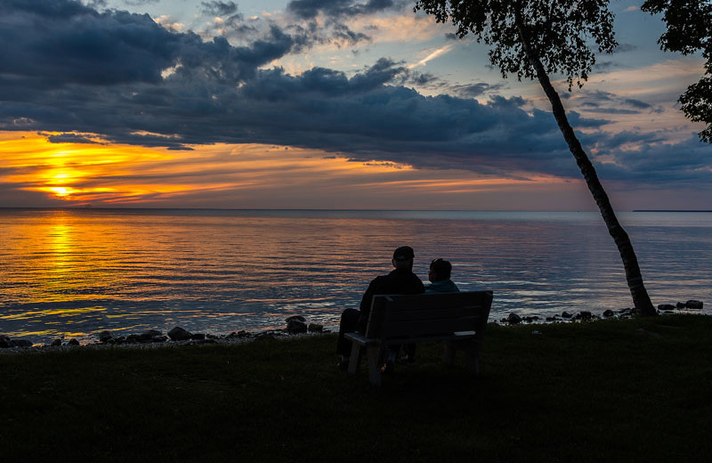 Couple watching the sunset at The Shallows Resort.