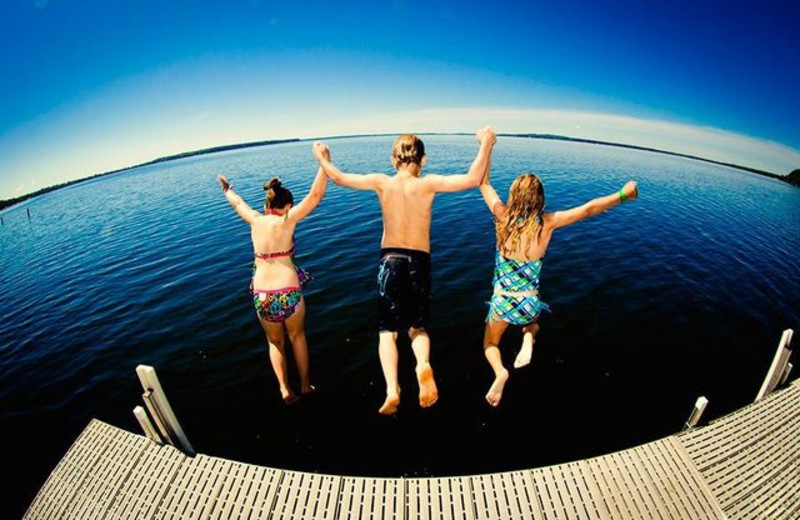 Kids jumping in lake at Grand View Lodge.