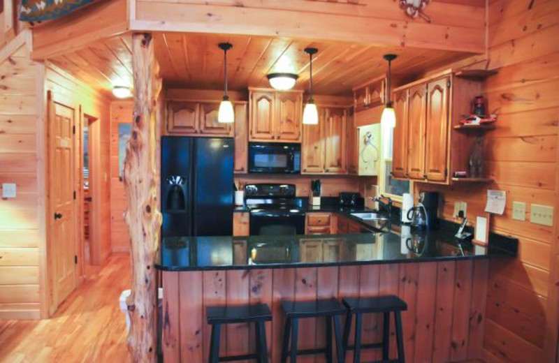 Cabin kitchen at Mountain Getaway Cabin Rentals.