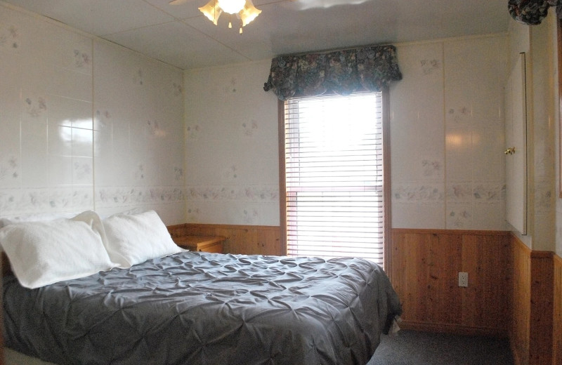 Cottage bedroom at Golden Beach Resort.