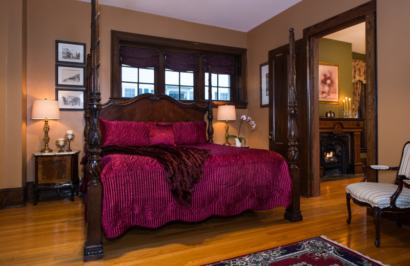 This very spacious two-room suite, with its own private parlor with fireplace, has a magnificently carved four-poster king bed and a large loveseat in the bay windows overlooking the back yard. It is located on the first floor of the inn, making it suitable for people with mobility issues.