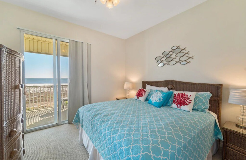 Rental bedroom at Beachfront Rentals and Sales.