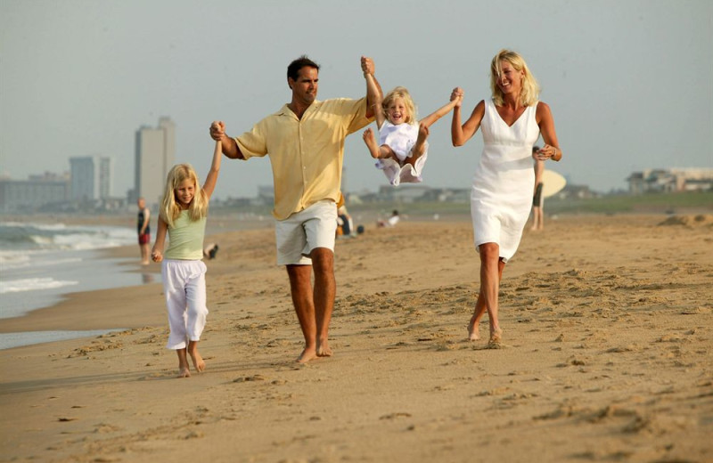 Family on beach at Gold Key Resorts.