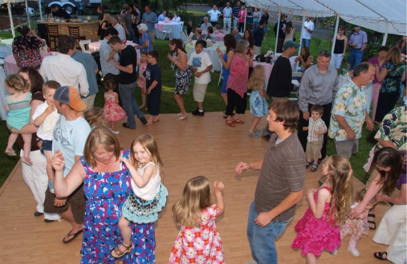 Family dancing on dance floor at Hood Canal Cottages.