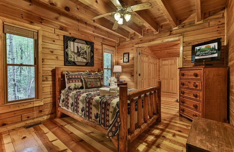 Cabin bedroom at Mountain Oasis Cabin Rentals.