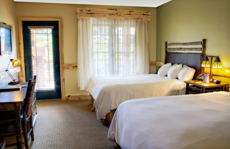 Guest bedroom at Hope Lake Lodge & Indoor Waterpark.