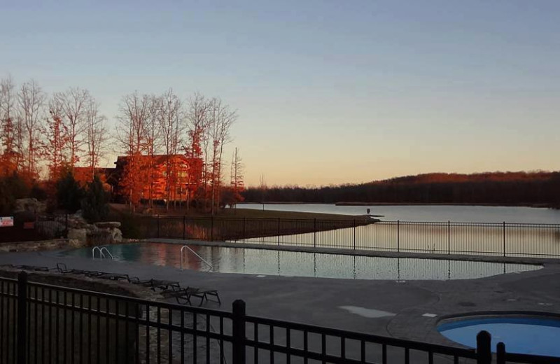 Outdoor pool and lake at Highland Rim Retreats.