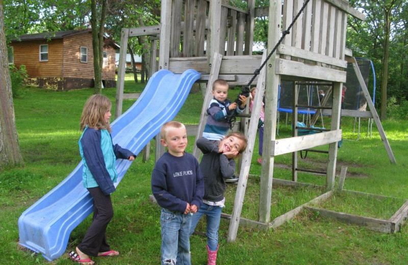 Kids playing on playground at Harris Hill Resort.