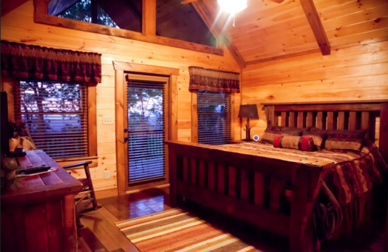 Cabin bedroom at Mountain Getaway Cabin Rentals.