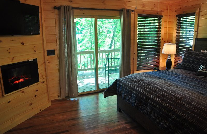 Cabin bedroom at Great Smokys Cabin Rentals.