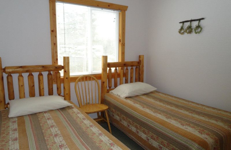 Cabin bedroom at Northern Lights Lodge & Resort.
