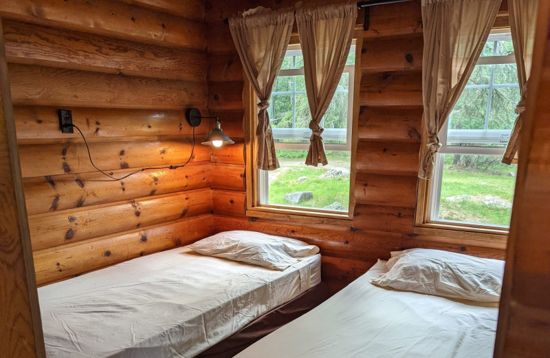 Cabin bedroom at Arrowhead Lodge & Resort.