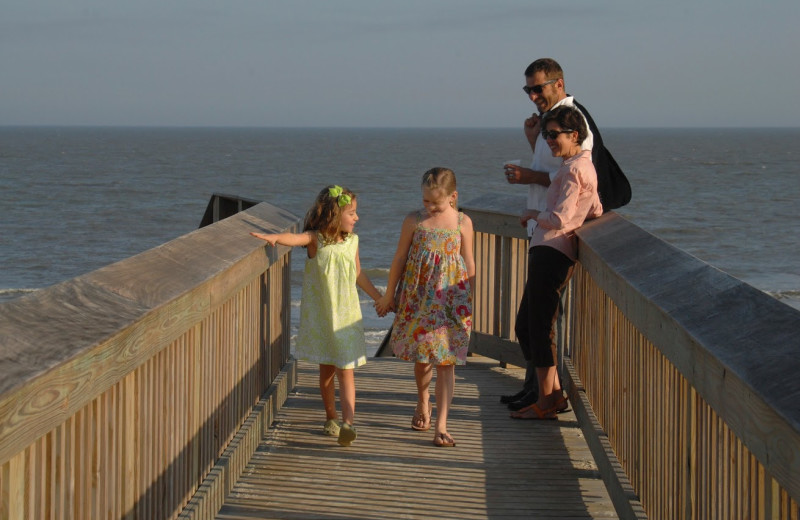 Family on the boardwalk at Hampton Inn & Suites Jekyll Island.