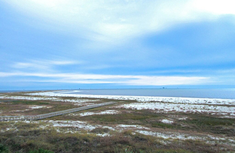 Beach view at Beachfront Rentals and Sales.