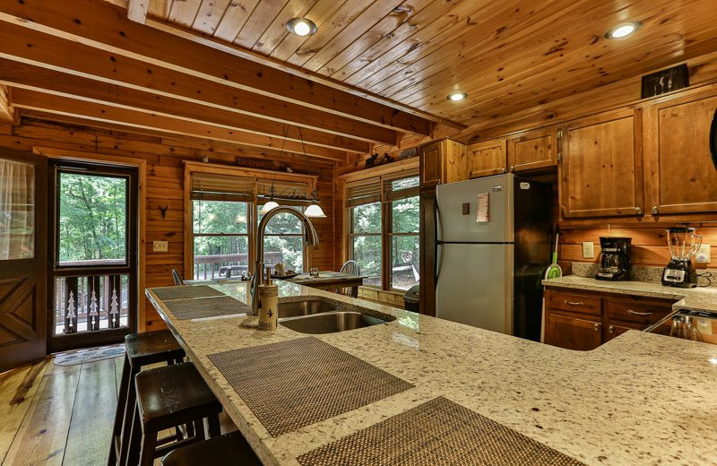 Cabin kitchen at Mountain Oasis Cabin Rentals.