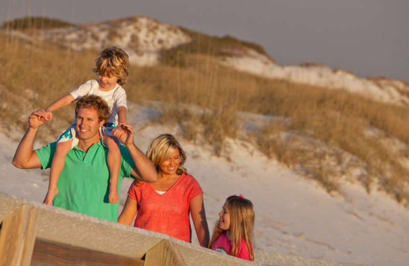 Family on the beach at Newman-Dailey Resort Properties, Inc. 