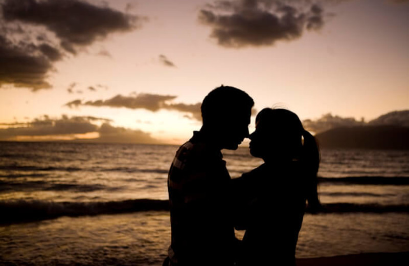 Couple on beach at Islander Hotel & Resort.