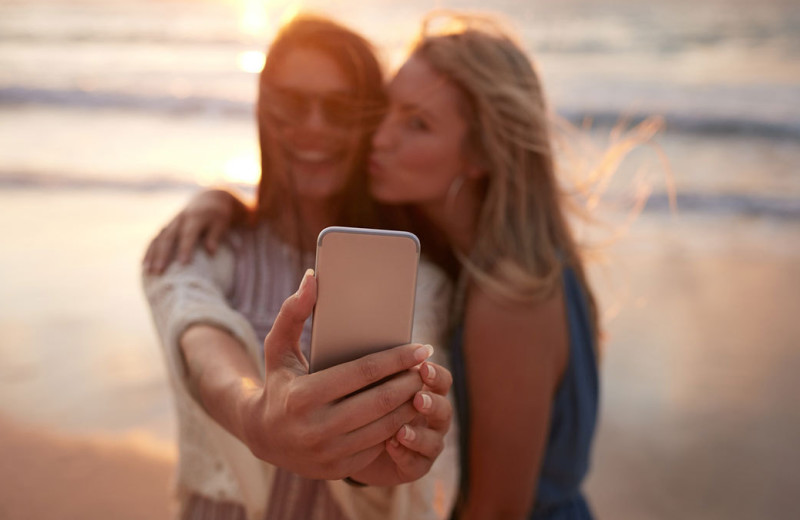 Couple on beach at Caprice Resort.