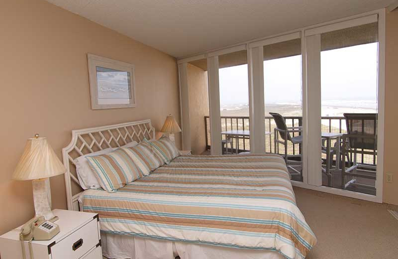 Condo bedroom at The Dunes Condominiums.