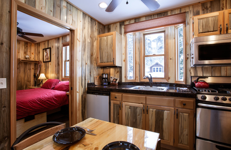 Cabin dining and kitchen at Izaak Walton Inn.