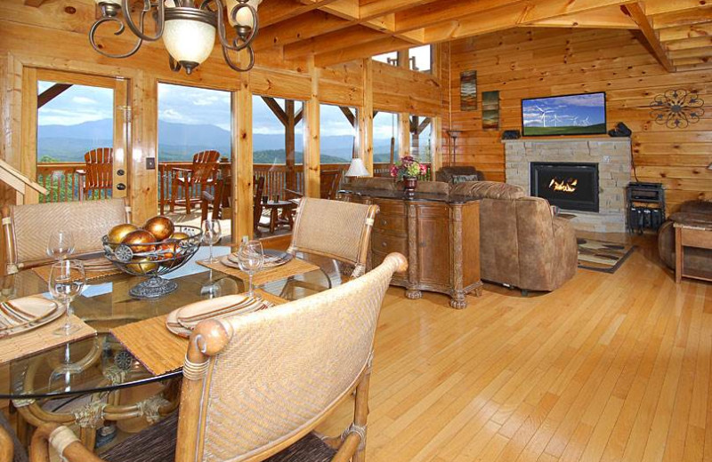 Cabin dining and living room at Timber Tops Luxury Cabin Rentals.