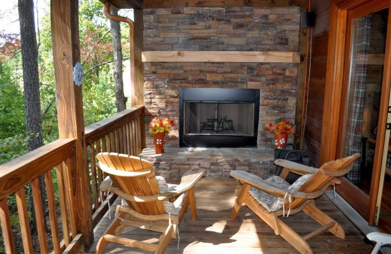 Fireplace deck at Cuddle Up Cabin Rentals.