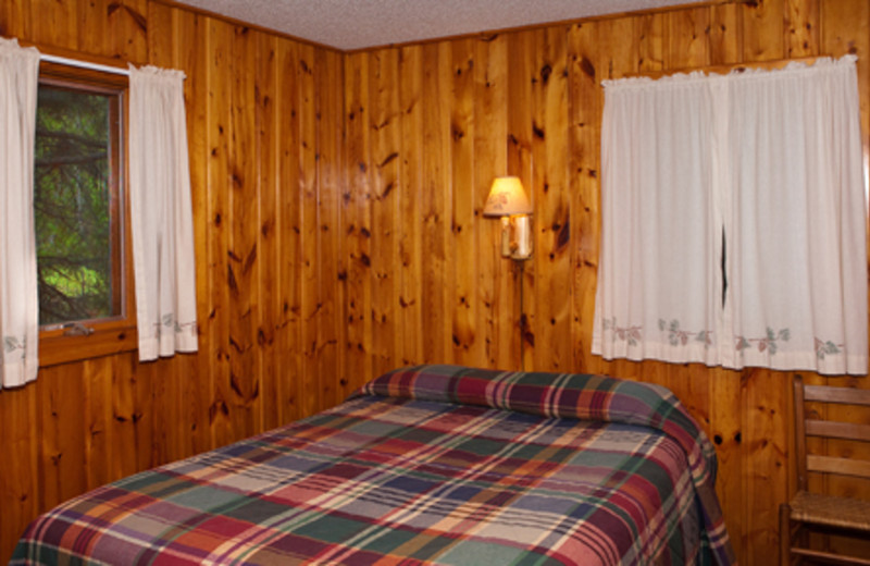 Cabin bedroom at Two Inlets Resort.