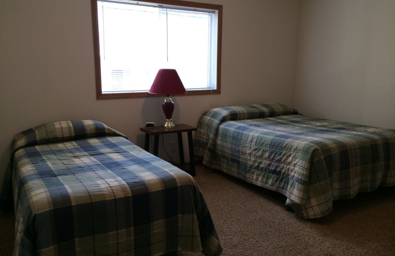 Cabin bedroom at Arnesen's Rocky Point Resort.