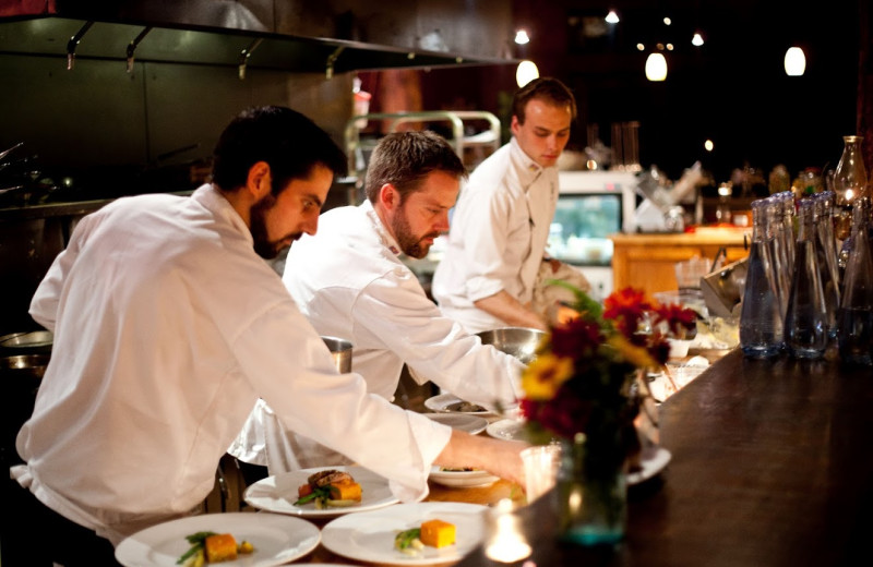 Chefs preparing at meal at Clayoquot Wilderness Resort.