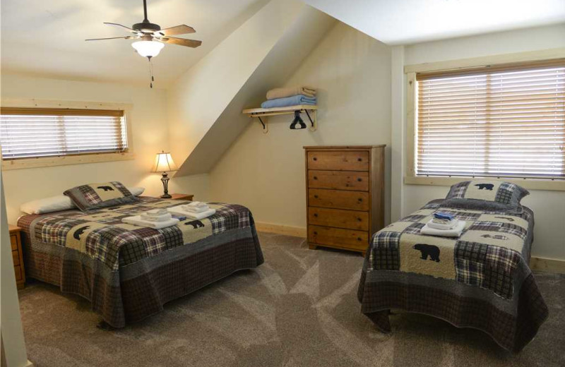 Cabin bedroom at Three Rivers Resort & Outfitting.