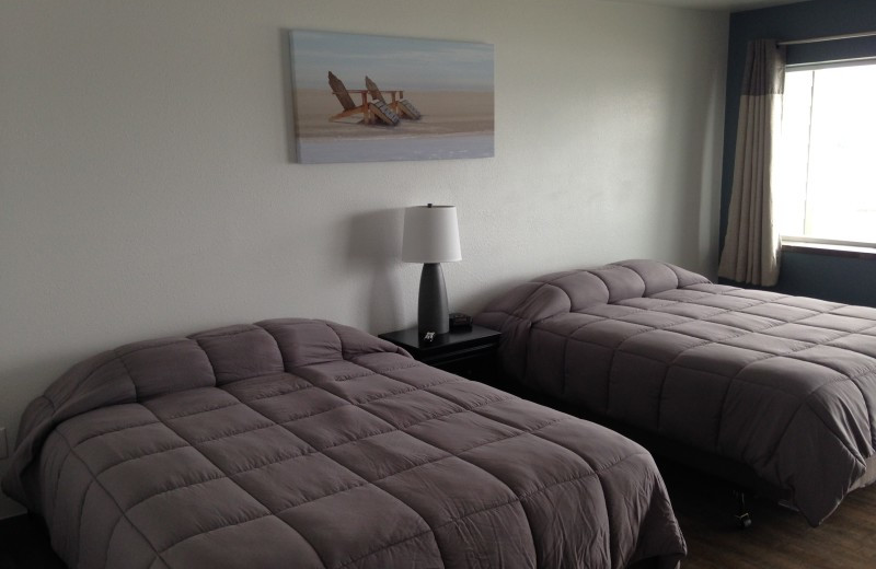 Guest beds at Sunset Oceanfront Lodging.