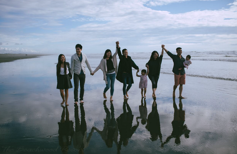 Family on beach at Beachwood Condos & Resort.