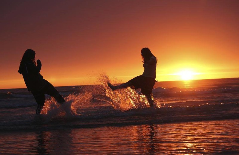 Splashing on the beach at The Strand Resort Myrtle Beach.